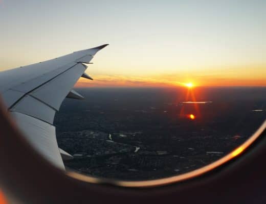 airplanes window view of sky during golden hour