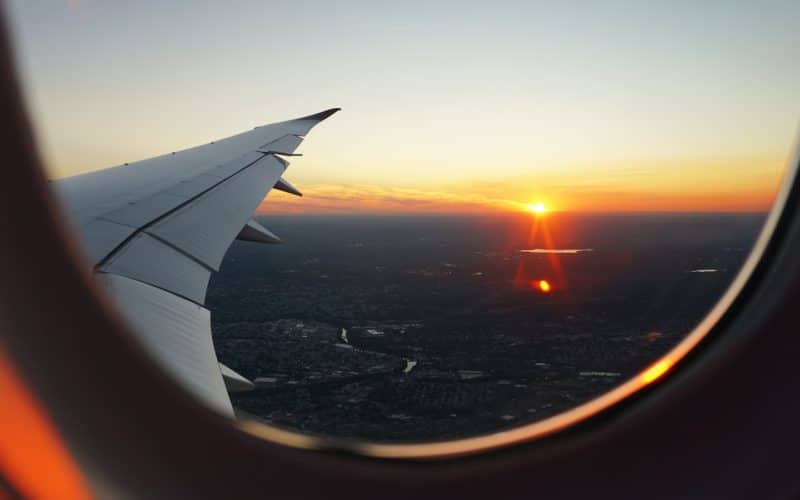 airplanes window view of sky during golden hour