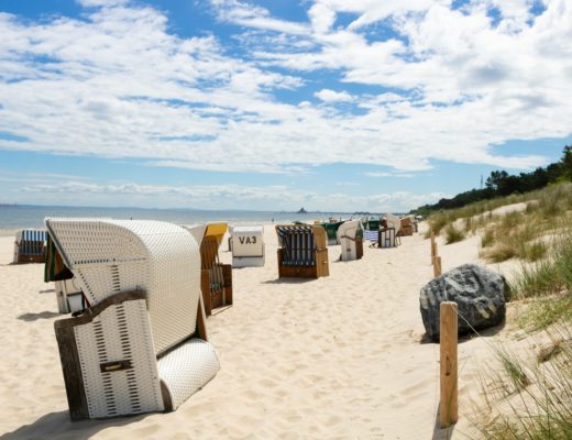 white and gray bench on seashore